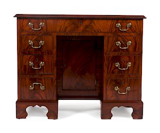 A George III Mahogany Knee-hole Desk
Height 29 x width 35 3/4 x depth 18 1/4 inches.