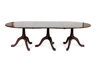 A Georgian Style Three-Pedestal Mahogany Dining Table
Height 29 x width 98 x depth 48 inches.