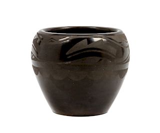 A San Ildefonss Blackware Pottery Jar
Height 4 1/2 x diameter 5 1/4 inches.