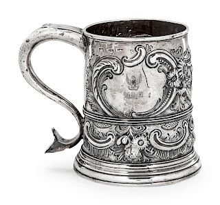 An English Silver Handled Cup
Exeter, Late 18th Century
with repousse decoration, monogrammed.