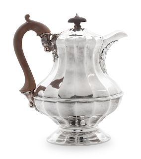 An English Silver Coffee Pot
London, c. 1824
with wooden handle.