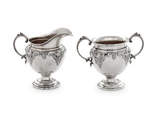 An American Silver Creamer and Sugar Set
R. Wallace & Sons Mfg. Co., Wallingford, CT
embossed with scrolls and flowers.