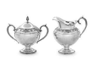 An American Silver Creamer and Sugar Set
International Silver Co., Meriden, CT
each with band of floral decoration.