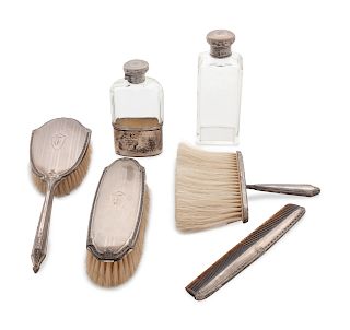 An Assembled American and English Silver Dresser Service
Various Makers
comprising a shoe horn, five brushes, two combs, a button hook, two perfume bo