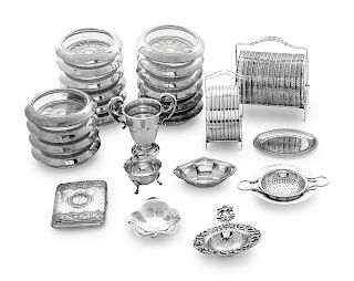 A Group of American, English and Canadian Silver Articles
Various Makers
comprising:8 small plates4 footed salts5 nut dishes8 silver and glass coaster
