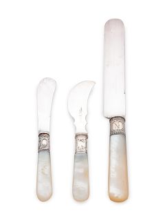 An Assembled Silver and Mother-of-Pearl Set of Knives
comprising:6 Eastern Silver Co. dinner knives6 Numsen Bros. butter spreaders6 Landers Frary & Cl