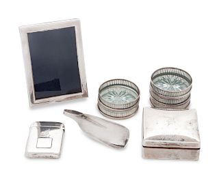 A Group of American and Canadian Silver Articles
Various Makers including Tiffany
comprising a picture frame, five silver and glass coasters, a trinke