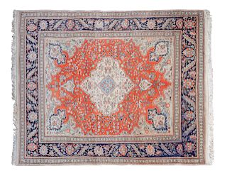 A Tabriz Carpet
9 feet 9 inches x 6 feet 11 inches.