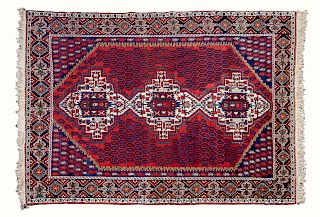 A Persian Rug
83 1/2 x 59 1/2 inches.