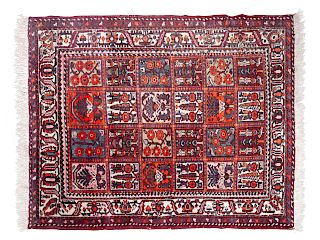 A Bokhara Wool Rug
6 feet 7 1/2 inches x 5 feet 3 inches.