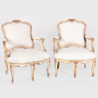 Pair of Louis XV Style Cream Painted and Parcel-Gilt Fauteuils à la Reine