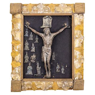 JESUS CRUCIFIED. MEXICO, BEGINNING OF THE 20TH CENTURY.Bronze. Framed and images of miracles on the back. 7 x 5 in