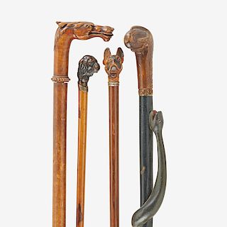 GROUP OF FIGURAL CANES WITH CARVED ANIMALS