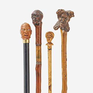GROUP OF FIGURAL CANES WITH FINELY CARVED HUMAN