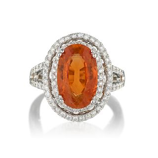 An Orange Sapphire and Diamond Ring