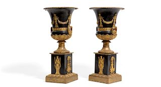 A pair of Empire gilt and patinated bronze urns