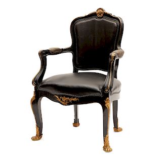 A Louis XV style ebonized fauteuil