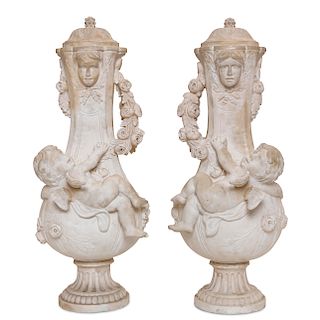 A pair of Neoclassical style marble covered urns