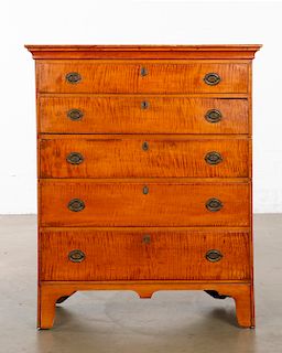A Chippendale tiger maple tall chest of drawers