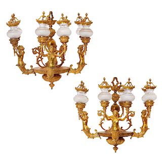 A pair of Louis XVI style gilt bronze chandeliers