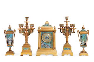 A French bronze and enamel clock garniture