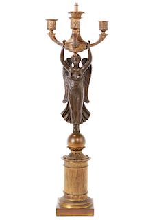 An Empire style bronze figural candelabrum