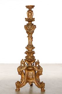 An Italian Baroque style giltwood torchiere