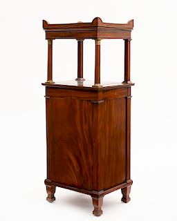 A Continental Neoclassical mahogany music cabinet