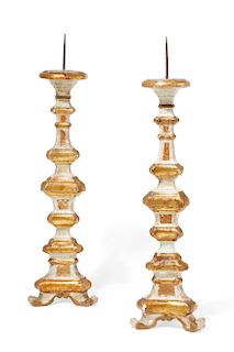 A pair of  Baroque gilt and painted  prickets