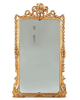 A Louis XVI style carved giltwood mirror