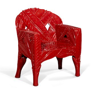 A Vermillion red painted banana leaf chair
