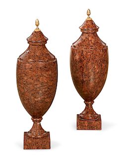A pair of Baltic Neoclassical style granite urns