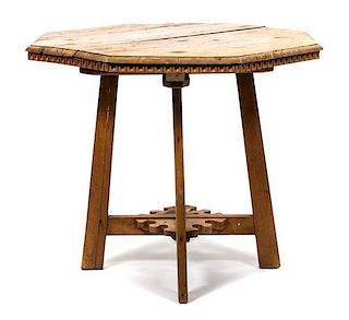 A Rustic American Pine Side Table Height 28 1/2 x diameter 23 inches.