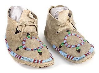 A Pair of Sioux Beaded Circle Moccasins Length 9 1/2 inches.