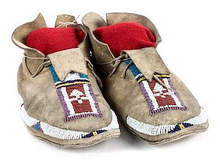 A Pair of Cheyenne Beaded Moccasins Length 10 1/2 inches.