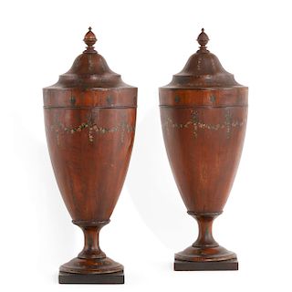 A pair of George III style mahogany knife urns