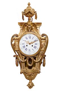 A Louis XVI style gilt bronze cartel clock