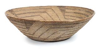 A Pima (Akimel O'odham) Basket Height 4 3/4 x diameter 16 1/4 inches.