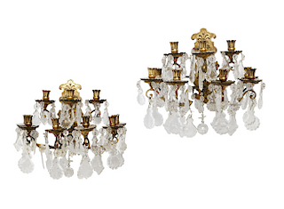 A pair of gilt bronze and cut glass wall sconces