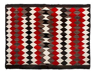 A Navajo Late Transitional Rug 60 x 76 inches.