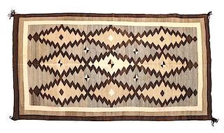 A Navajo Crystal Rug First: 75 1/2 x 46 1/2 inches.