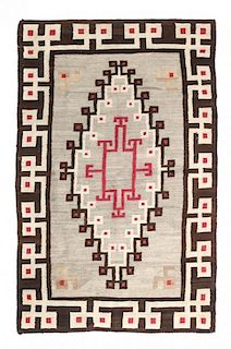 A Navajo Crystal Rug First: 70 x 42 inches.