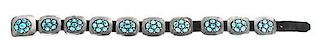A Silver and Turquoise Concha Belt, Frank Patania Jr. Length of belt 34 1/4; height of buckle 2 1/2 x 3 inches.