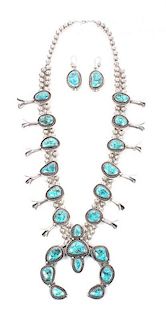 A Navajo Silver and Turquoise Squash Blossom Necklace Length of necklace 24 inches, naja 3 3/4 x 3 1/2 inches.
