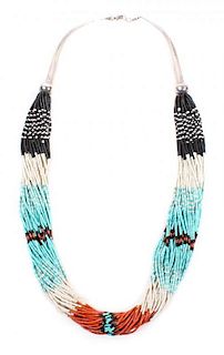 A Santo Domingo Multi-Strand Turquoise, Jet, Coral and Shell Heishi Necklace Length 28 inches.