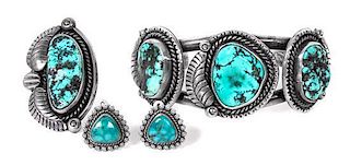 A Southwestern Silver and Turquoise Cuff Bracelet and Ring Length of bracelet 5 1/2 x opening 1 3/8 x width 1 3/8 inches.