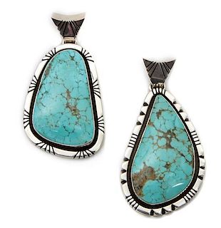 A Pair of Silver and Turquoise Pendants, Edison Begay Height 2 5/8 inches.
