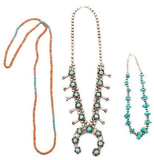 A Southwestern Silver and Turquoise Squash Blossom Necklace Length of first 12 1/4; height of naja 2 5/8 x width 2 7/8 inches.