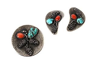 A Southwestern Style Brooch and Earrings Diameter of brooch 2 inches.