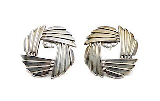 A Pair of Navajo Silver Earrings, Harvey Begay Diameter 1 1/4 inches.